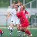Father Gabriel Richard's Tymi Staub and Hanover-Horton's Alyson Wood fight for the ball during the first half of the regional semifinal game at Father Gabriel Richard High School, Wednesday, May 29.
Courtney Sacco I AnnArbor.com  